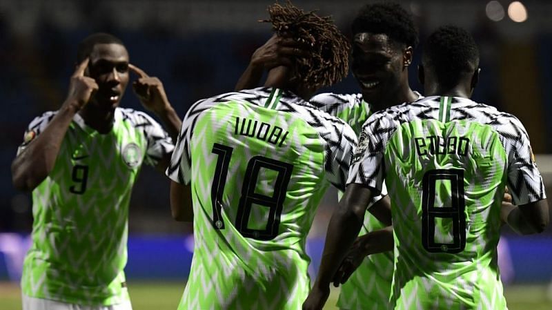 Iwobi celebrates with teamwhile star man Ighalo (far left) stresses they keep their heads