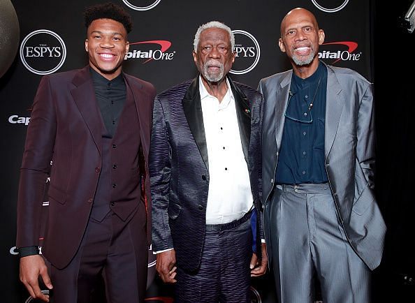 Giannis posing with NBA legends Bill Russell and Kareem Abdul-Jabbar