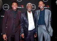 Giannis posing with NBA legends Bill Russell and Kareem Abdul-Jabbar