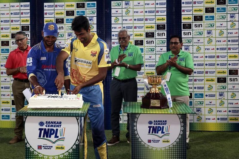 KB Arun Karthick and Ravichandran Ashwin cut a cake as part of the 100th match celebrations of the TNPL 2019