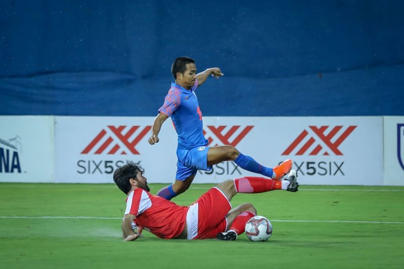 Tajikistan&#039;s Siyovush Asrorov lunges on Lallianzuala Chhangte which eventually awards India a penalty