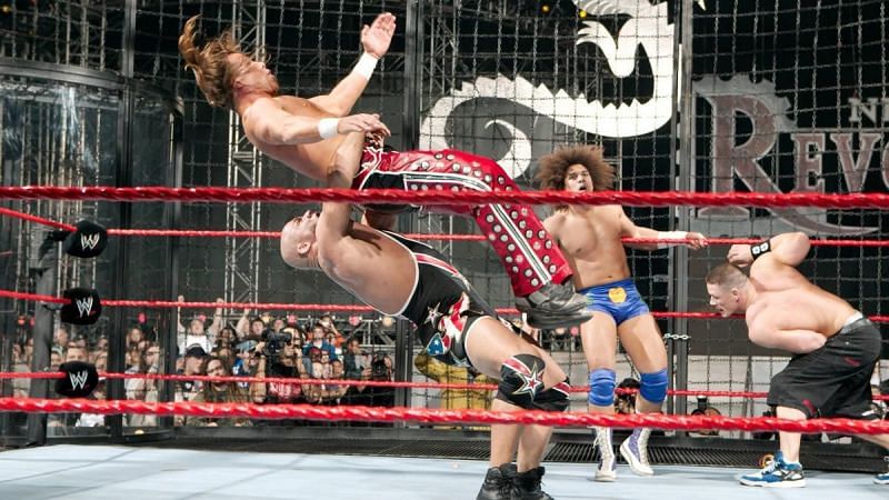 A weary John Cena and Carlito look on as Kurt Angle takes Shawn Michaels to Suplex City