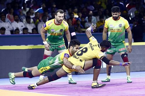 Telugu Titans raider Suraj Desai deals with the Patna Pirates