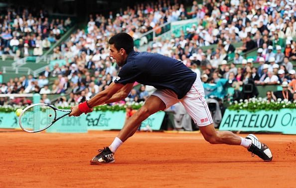 Djokovic beats Federer in straight sets to reach first Roland Garros final