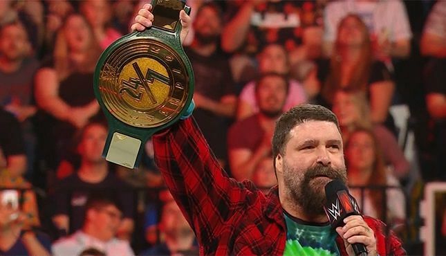Mick Foley with the 24/7 title