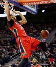 AD completes a dunk against the Pistons
