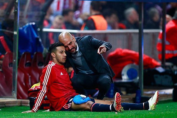 Pep Guardiola with Thiago on the touchline in a UCL game.