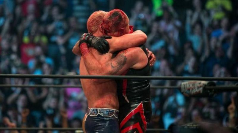 The Rhodes Brothers embrace after an emotionally charged, bloody battle that left wrestling fans going bananas on social media.