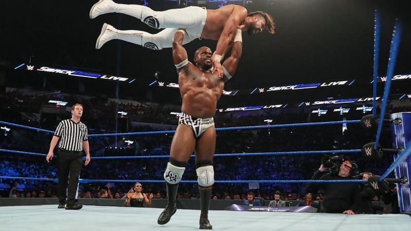 Apollo Crews lifts Andrade into a gorilla press slam