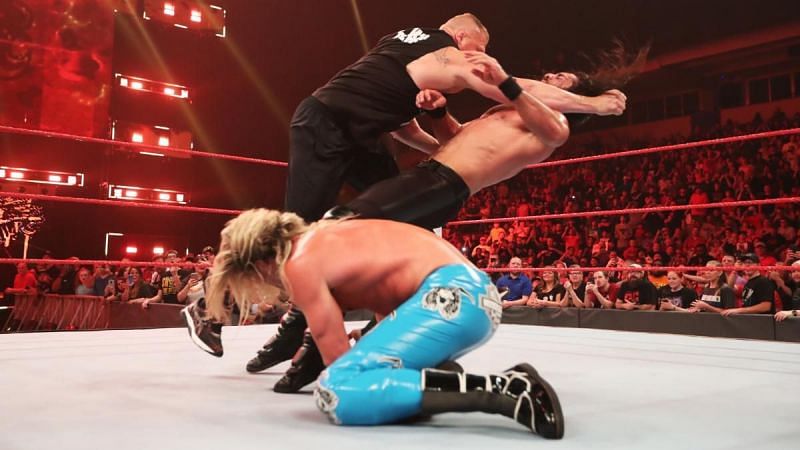 Lesnar clotheslines Rollins on RAW