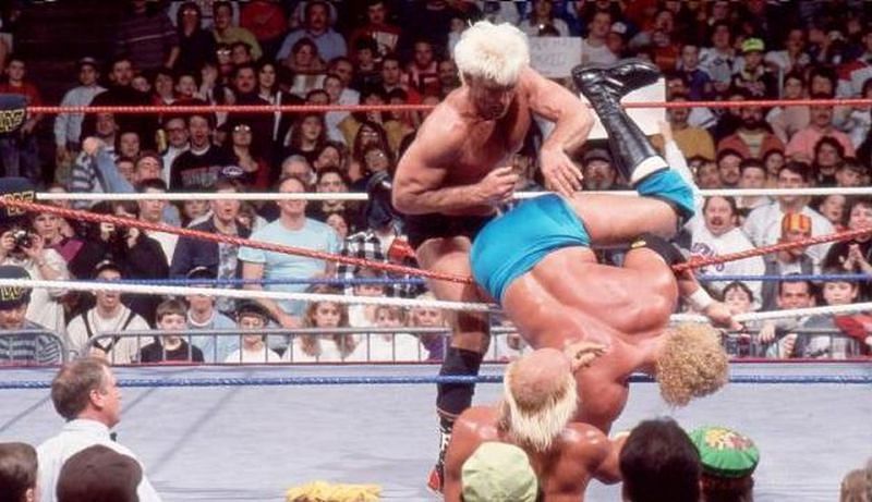 Ric Flair last eliminates Sycho Sid to win the 1992 Royal Rumble match (and the WWE title)