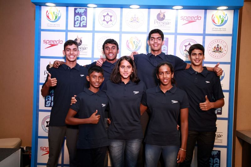 Swimmers present at the launch pose for a picture