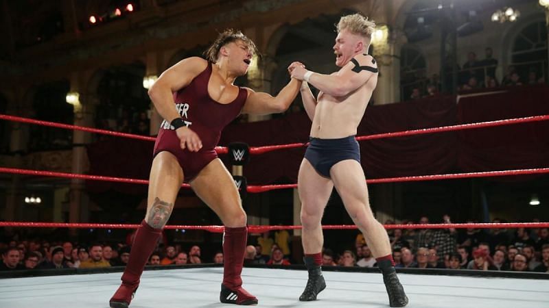 Tyler Bate locks in a joint submission on Pete Dunne during one of their many stellar encounters.