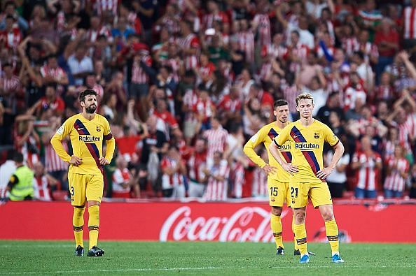 Barcelona players wear a forlorn look after their stunning loss at Athletic Bilbao last n