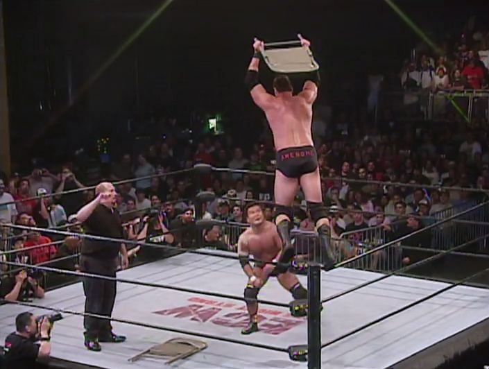 Mike Awesome proves worthy of his nickname by leaping off the top rope with a steel chair in hand