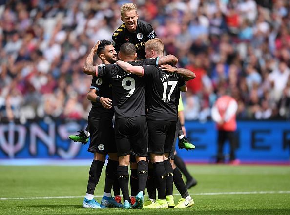 Manchester City players celebrate during their thumping 5-0 win over West Ham to start the season in style