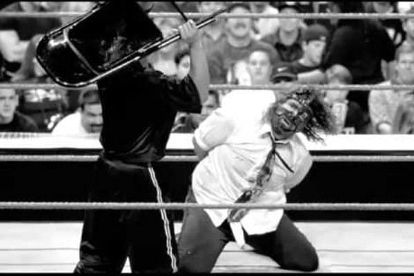 The Rock tees up on a handcuffed Mankind at their I Quit match at Royal Rumble