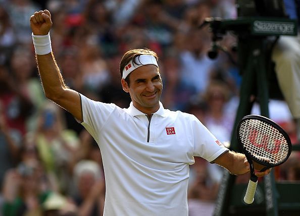 Federer exults after beating Kei Nishikori for his 100th Wimbledon match win