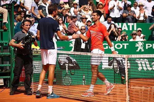 Daniil Medvedev (L) and Novak Djokovic