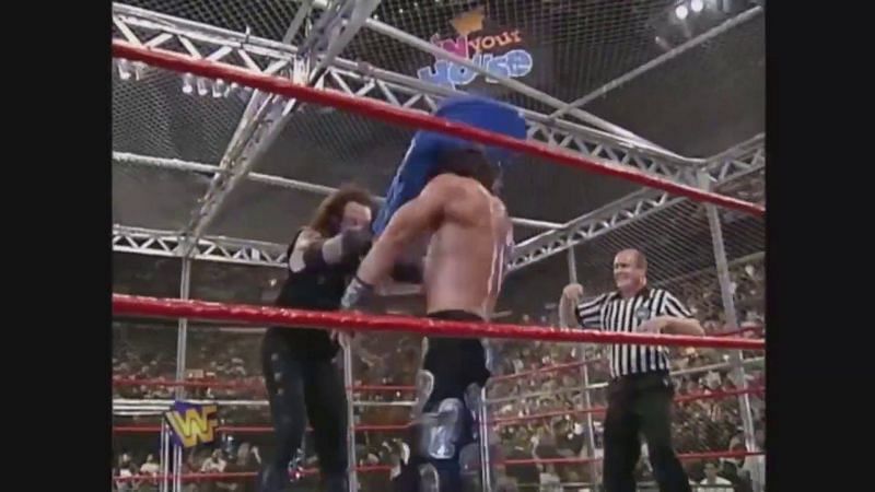 The Undertaker mashes HBK&#039;s noggin with a brutal chair shot.