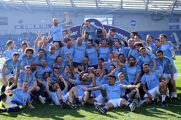 Manchester City celebrate winning the 2018-19 Premier League Trophy