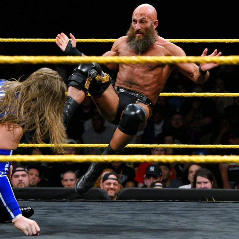 Tommaso Ciampa unleashes a shining wizard on Kassius Ohno.
