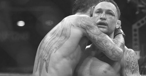 Max Holloway hugging Frankie Edgar after the UFC 240 main event.