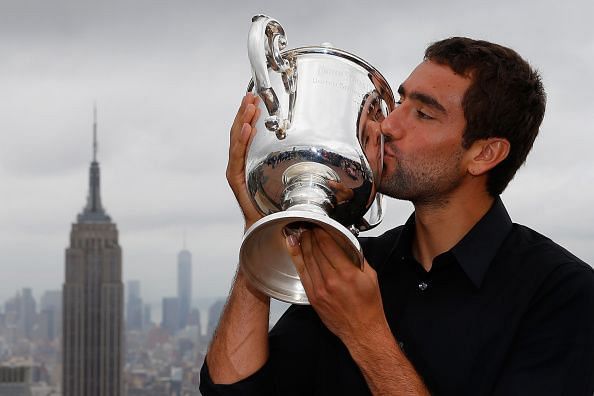 Marin Cilic poses with his first Grand Slam title at the 2014 US Open