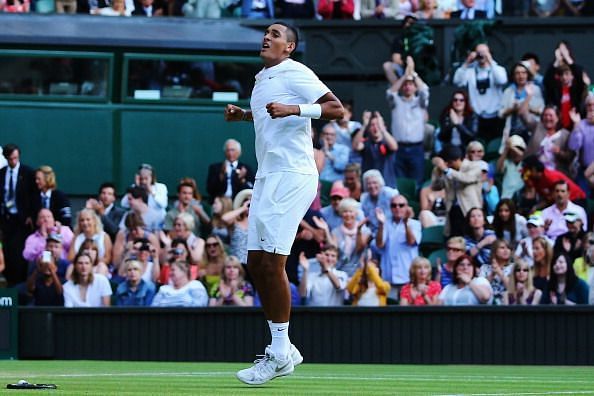 Kyrgios exults after beating Nadal in the fourth round at 2014 Wimbledon.
