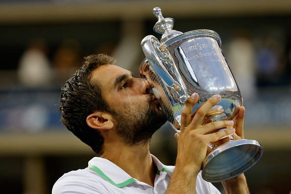 Cilic holds aloft his maiden Grand Slam trophy at the 2014 US Open