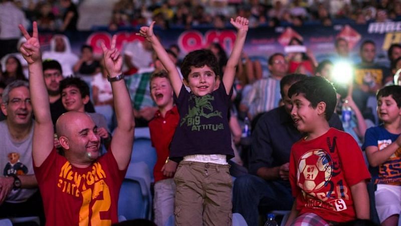 Young WWE fans at a live event in Dubai, UAE