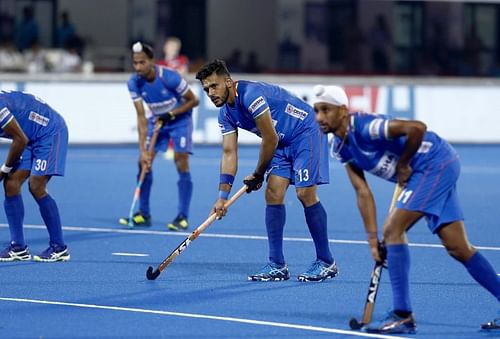 Harmanpreet Singh (centre) preparing to take a Penalty Corner