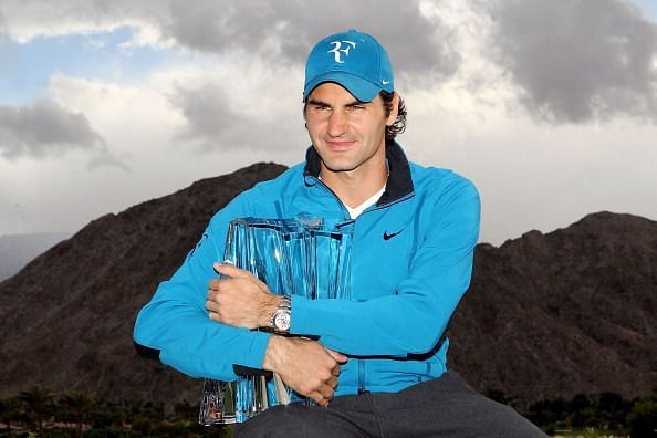 Federer poses with his fourth Indian Wells title in 2012