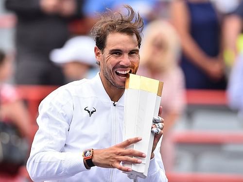 Rafael Nadal with the Rogers Cup trophy