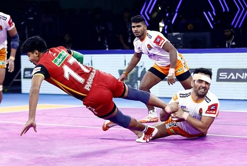 Surjeet Singh pulls off a successful ankle hold on Pawan Sehrawat