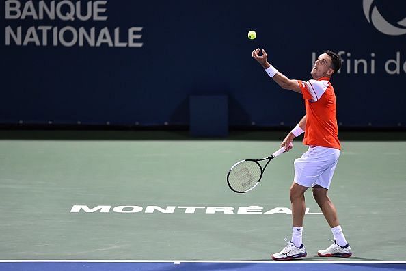 Bautista Agut serves to Gasquet during his 3rd round win over the Frenchman