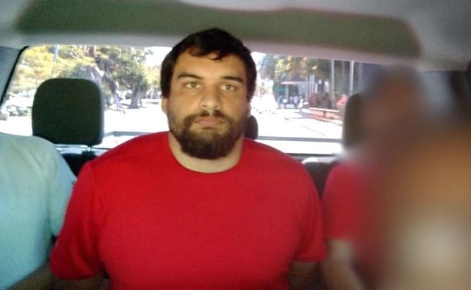 Son of ex-NFL player accused of murdering parents arrested