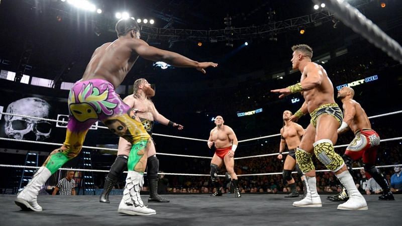 Velveteen Dream, Adam Cole, EC3, Killian Dane, Lars Sullivan, and Ricochet eye the NXT North American title high over the ring during Takeover&#039;s wild ladder match.