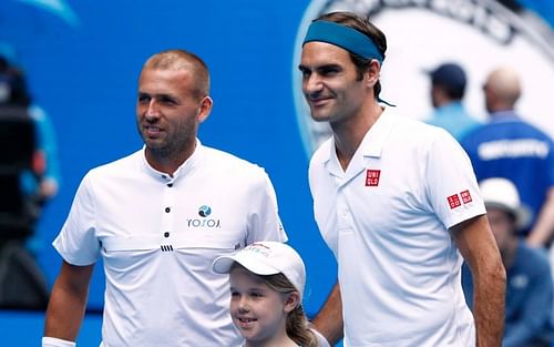 Dan Evans (left) and Roger Federer