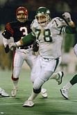 Son charged in death of ex-NFL lineman Bennett, wife