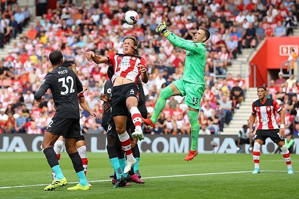 Adrian rushing out to punch clear from an aerial ball fizzed into the box