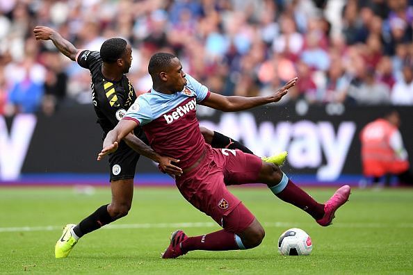 Issa Diop in action against Raheem Sterling of Manchester City - Premier League