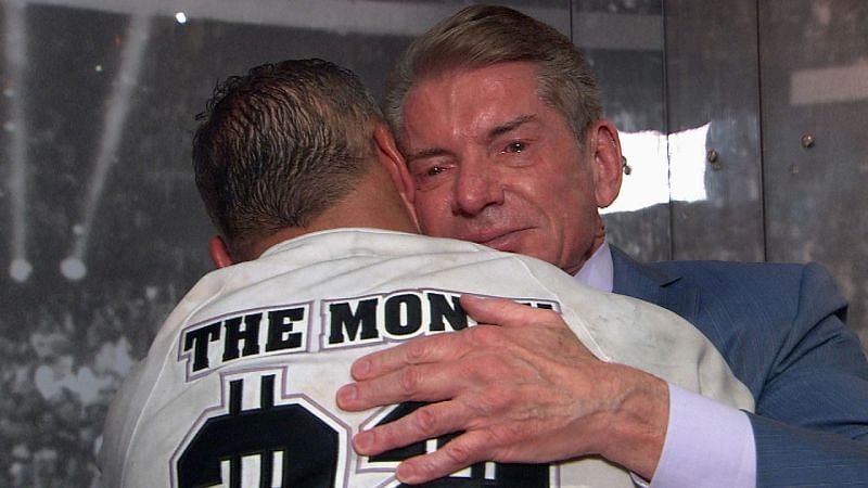 Vince hugs his son Shane after the younger McMahon&#039;s match at WrestleMania 32.