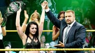 Triple H congratulates the first NXT Women's Champion