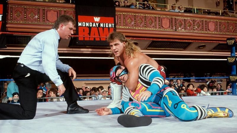 Shawn Michaels--resplendent in his 1990s mullet--puts the squeeze on Max Moon. Believe it or not, this is a match for the Intercontinental championship.