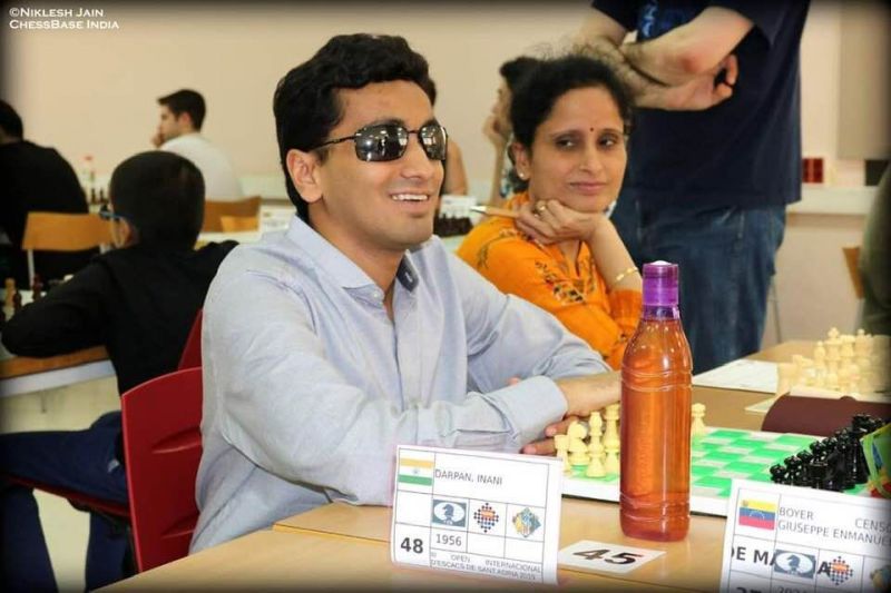 Visually impaired chess player Darpan Inani shows his opponents he