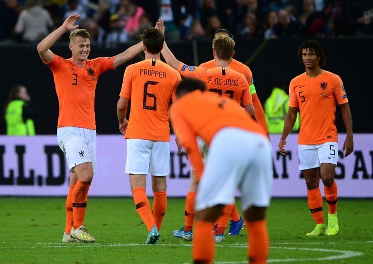 The Netherlands rejoice after their come-from-behind 4-2 win over Germany in Hamburg