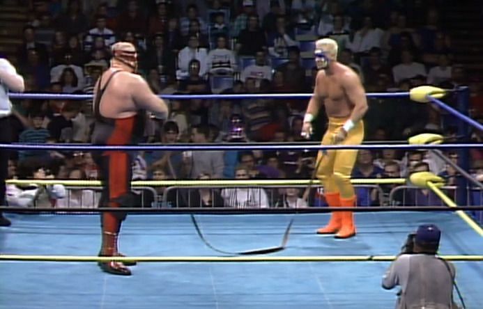 Sting and Vader in a vicious strap match.