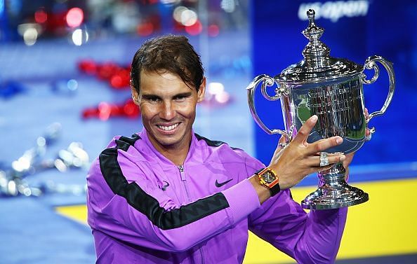 Nadal hoists aloft his 4th title at Flushing Meadows