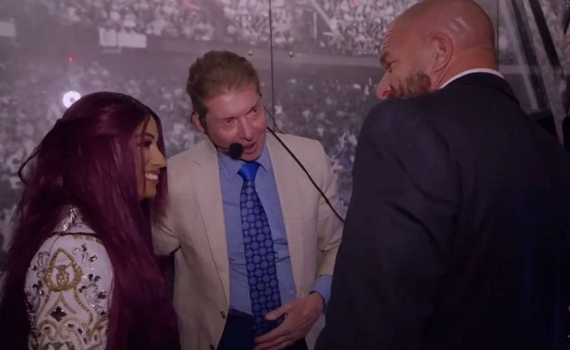 Sasha Banks with Vince McMahon and Triple H backstage